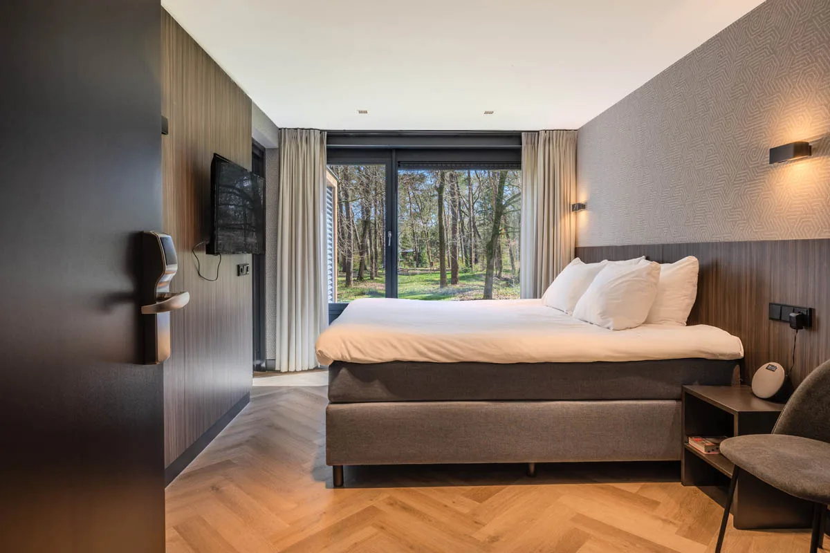 Modern hotel room at De Werelt in Lunteren overlooking the Veluwe forest
